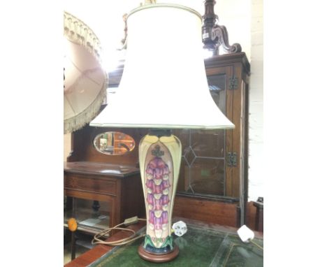 A Moorcroft table lamp by Rachael Bishop decorated with foxgloves on a slender baluster body, approx height with shade 73cm. 