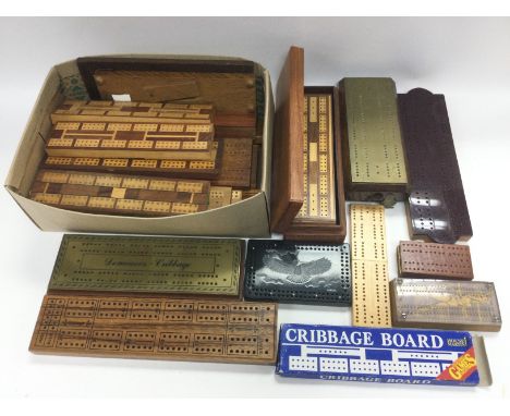A collection of various cribbage boards. Shipping category C.