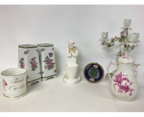 A collection of ceramics including a floral candelabra, an enamel and brass photo frame and a ceramic figure. Postage cat D N