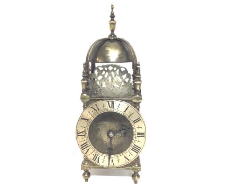 Brass lantern styled clock with French drum movement, working order. 30cm tall approximately postage cat C