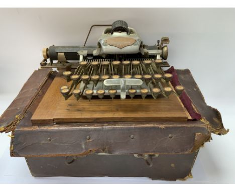 A vintage Aluminium featherweight Blickenserfer typewriter in leather case. (D)