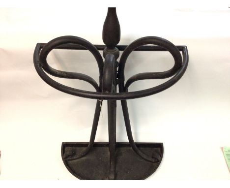 A metal stick stand 77cm tall by 46cm wide. Comes with two walking sticks. Postage D