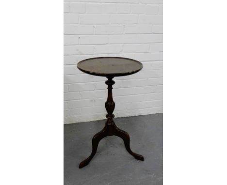 A mahogany wine table on baluster column and tripod supports, 64cm high