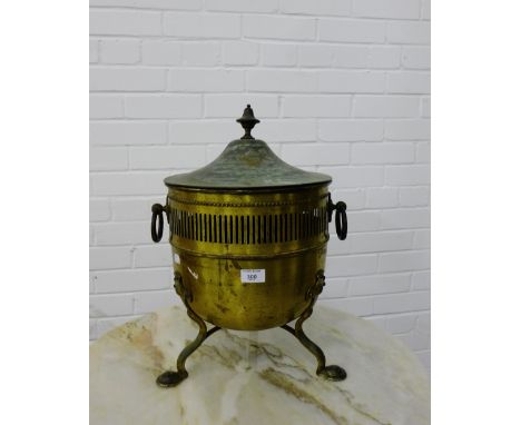 A brass coal bucket with twin handles to side on tripod supports, 50cm high