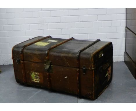 A canvas and wooden bound cabin trunk with leather handles to side, 42 x 86cm