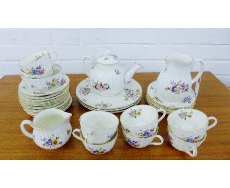 A Royal Worcester Roanoke pattern teaset comprising teapot, cream jug, large jug, sugar bowl, three cake plates, eight cups a