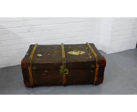 A canvas and oak bound cabin trunk with leather handles to side, 35 x 85cm