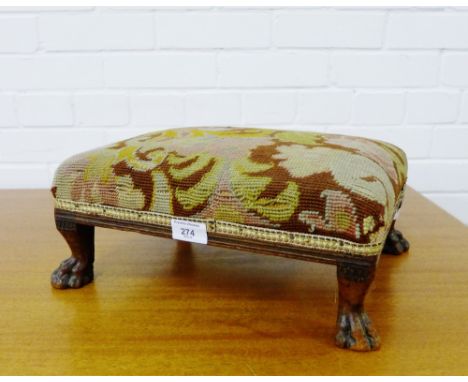 A tapestry upholstered foot stool on carved paw supports, 37 x 15cm
