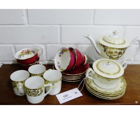 A porcelain tea set to include Paragon claret glazed and floral patterned cups and saucers and a Japanese Meito china set, (2