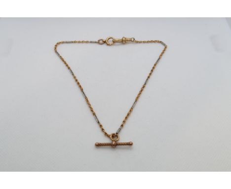 An 18ct (hallmarked) bi colour chain with T bar - weight approx 11.7 grams - 33cm - one ring tested as approx 9ct 