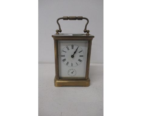 A crass cased four glass carriage clock - 10.5cm - good overall condition - with alarm sub-dial and bell - alarm not currentl