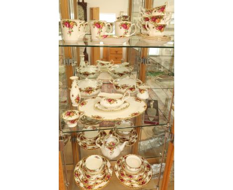 A Royal Albert Country Rose dinner and tea service - please see images for item list 