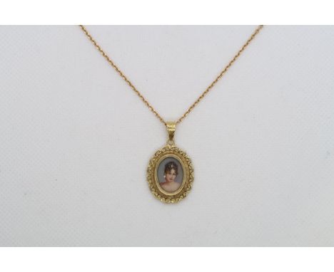 An 18ct yellow gold (hallmarked) pendant on chain - oval pendant with miniature portrait 2.5cm excluding ring - chain 67cm - 