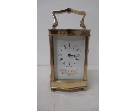 An Asprey serpentine case brass carriage clock with hand painted dial - working, with key - approx height 12cm 