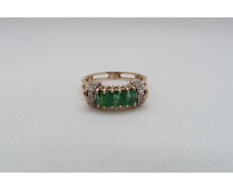 A 14ct yellow gold (hallmarked) emerald ring with diamonds - ring size P - approx weight 3.8 grams 