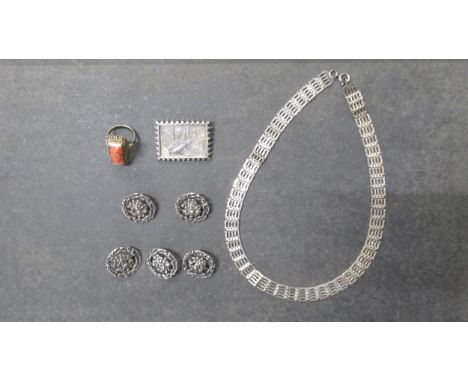 Silver jewellery to include five Art Nouveau buttons, silver gilt and coral hinged ring, necklace and brooch 