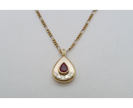 An 18ct yellow gold (hallmarked) pendant on chain - Drop shaped and set with ruby and diamond accent to ring - approx 3cm wit