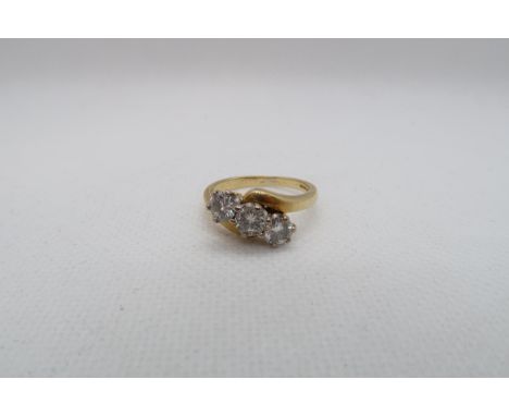 An 18ct yellow gold (hallmarked) three stone diamond ring -total round brilliant cut diamond weight approx 1ct - ring size N 