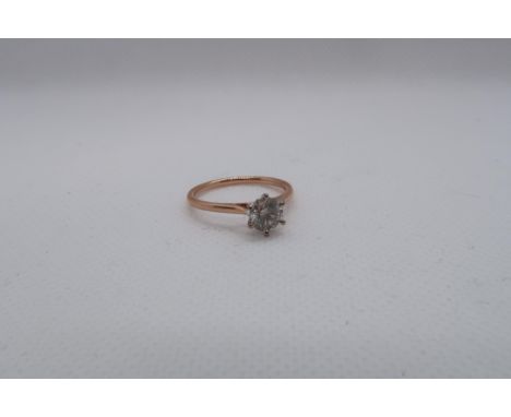 A certificated 18ct white and rose gold round brilliant cut diamond solitaire diamond ring - Diamond 0.78ct. Cert no. WGI9624