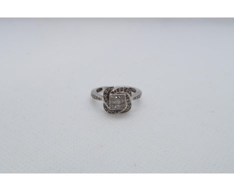 A 9ct white gold (hallmarked) diamond cluster ring with nine central square cut diamonds - ring size J/K - approx weight 2.6 