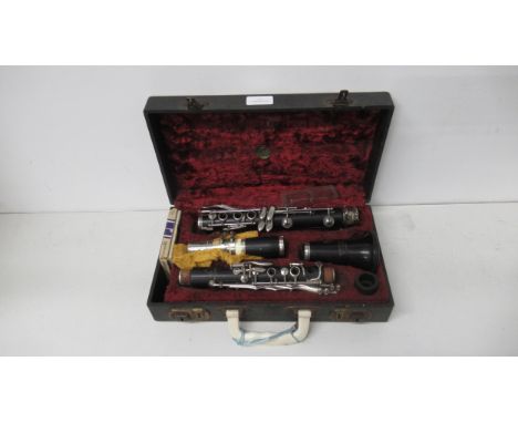 A Boosey &amp; Hawkes clarinet in fitted leather case, complete with accessories 