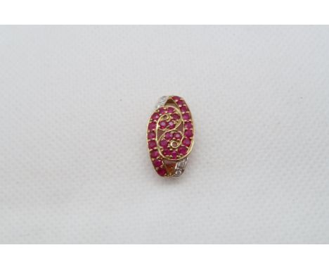 A 9ct yellow gold ruby and diamond pendant - head size 20mm x 12mm 