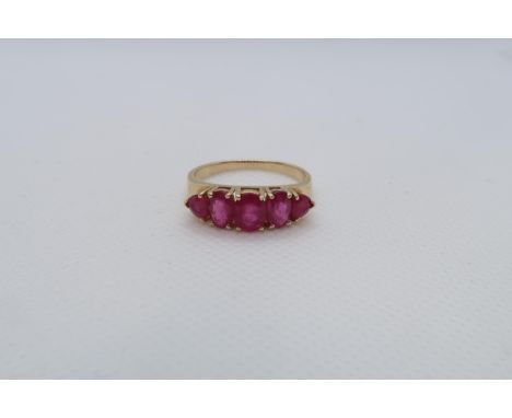 A 14ct yellow gold (hallmarked) and ruby five stone bridge ring size R/S - weight approx 3.7 grams 