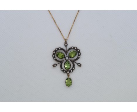 A 9ct yellow gold and silver vintage style necklace set with peridots, diamonds and a seed pearl, boxed 