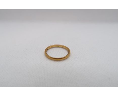 A 22ct yellow gold (hallmarked) band - ring size P/Q - weight approx 3.5 grams 