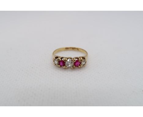 An approx 18ct (tested) yellow gold ring with diamonds and rubies - ring size K/L - weight approx 2.1 grams 