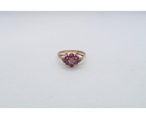 A 9ct yellow gold (hallmarked) ruby and diamond cluster ring size I/J - approx weight 1.8 grams 