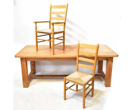 A large pine kitchen/dining table with square carved reeded legs, united by a stretcher, 76 x 214 x 91cm, together with a set