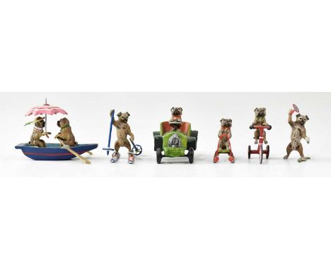 AFTER FRANZ BERGMAN; a group of six Austrian cold painted models of pug dogs, some bearing 'FB' monogram, all engaged in outd
