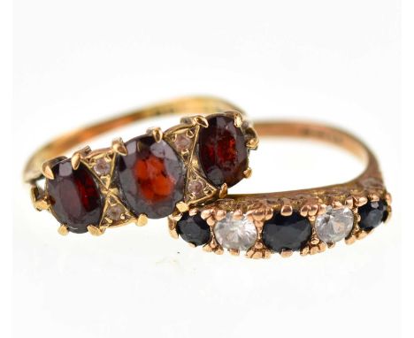 A 9ct gold ring set with three graduated garnets separated by two rows of two tiny diamond chips, size K, and a 9ct rose gold