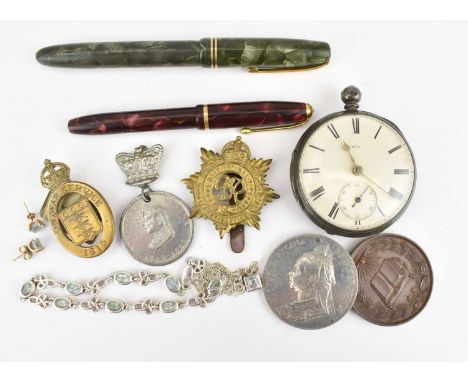 A collectors' lot comprising two vintage fountain pens, a key wind silver cased open face pocket watch, a silver and blue sto