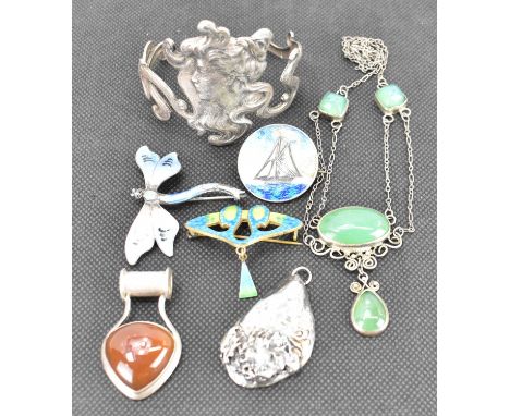 Art Nouveau and Art Deco jewellery comprising a bracelet with stylised lady's head, 6cm, a green and blue enamelled brooch, w