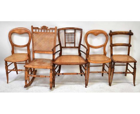 Five various Victorian and Edwardian bergère seated chairs comprising a pair of balloon backs, a ladder back, rocking chair a