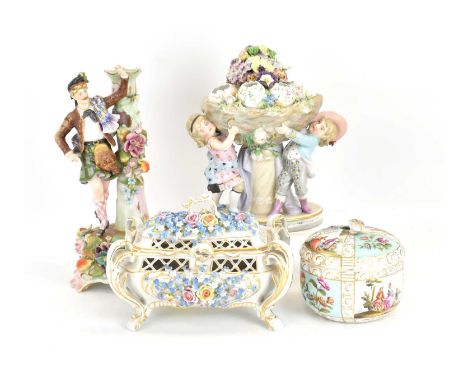 Four late 19th/early 20th century Continental porcelain figures to include a figure group of two children holding a nest of e