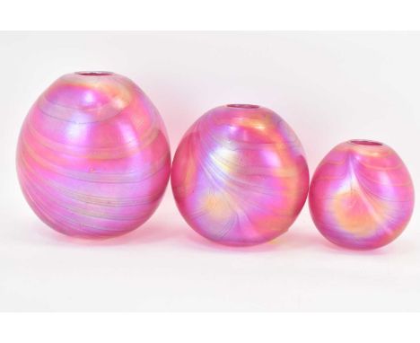 IN THE MANNER OF GLASFORM; three graduated pink iridescent glass vases, heights 16cm, 13cm, and 10cm (3)Condition Report: All