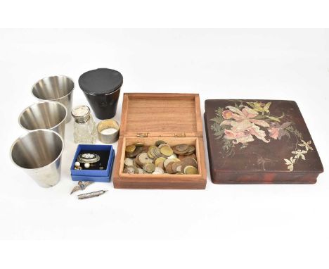 A collectors' lot comprising British and World coins, a brass inlaid wooden box, a leather pouch with four plated travel cups