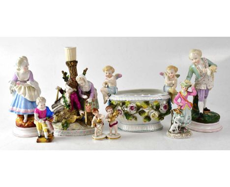 A pair of 19th century Augustus Rex figures of a bowing gentleman and lady, together with six other porcelain items to includ