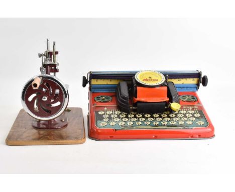 A boxed Mettype Junior child's typewriter with lithograph printed detail, and an Essex miniature sewing machine (2).