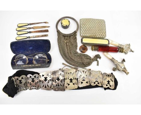 A collectors' lot to include a silver plated open floral belt, two mother-of-pearl teething rings, one with bells and whistle