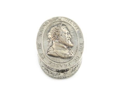 A late 19th century silver box, marked 13, probably German, oval form, the hinged cover embossed with a male portrait and ins