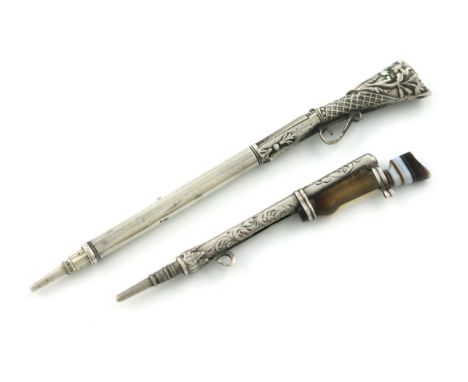 A Victorian novelty silver pencil, unmarked, modelled as a rifle, the butt with embossed decoration, length 7.4cm, plus a sil