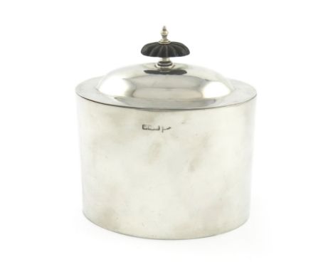 An Edwardian silver tea caddy, by Walker and Hall, Sheffield 1905, oval form, domed pull-off cover with a fluted finial, leng