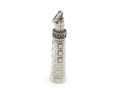 A Victorian novelty silver pencil, unmarked, modelled as a lighthouse, with a ring attachment, length 4.5cm. Provenance: The 