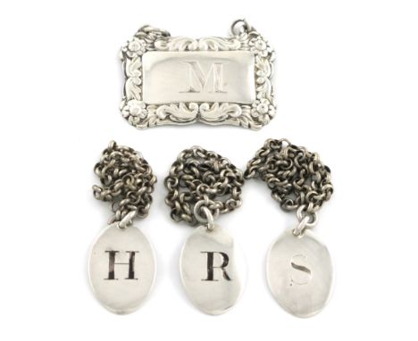 A set of three early 19th century small silver wine labels, maker's mark CC, oval form, incised and blackened 'R', 'H' and 'S