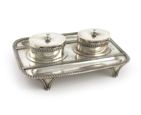 An Edwardian silver double inkwell, by The Goldsmiths and Silversmiths Company, London 1901, rectangular form, gadroon border