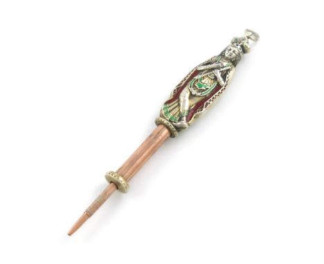 A novelty silver-gilt and enamel pencil, unmarked, modelled as an Indian goddess, with blue, green and red enamel decoration,